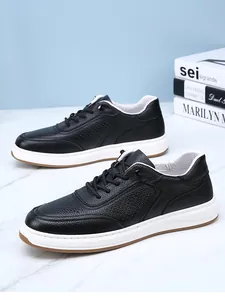 Detailed side view of men's black breathable cowhide leather sneakers with thick white soles.