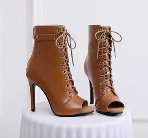 Detailed side view of brown peep-toe lace-up jazz dance boots with high heels