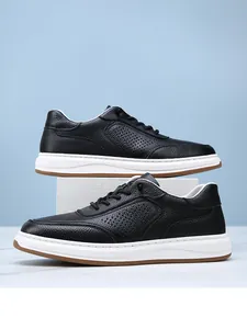 Detail of black pebbled leather men's sneakers with breathable perforated hollowed design