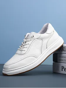 Detailed side view of white genuine leather men's sneakers with pebbled texture