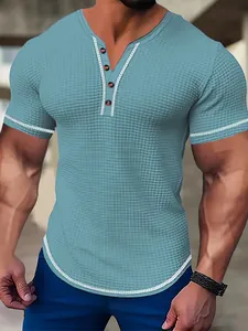Close-up of men's slim fit blue waffle knit henley shirt with button placket