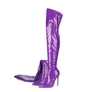 Detailed view of purple patent leather thigh-high boots with stiletto heel and pointed toe