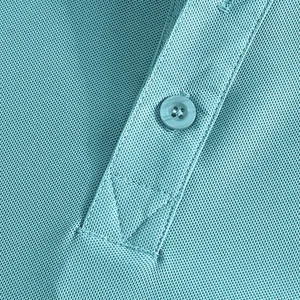 Detailed close-up of light blue polo shirt placket showing button and breathable pique fabric