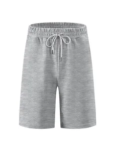 Close-up detail view of grey men's summer shorts with premium textured diamond jacquard fabric