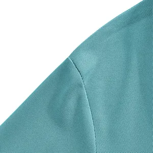 Close-up of turquoise breathable quick-dry fabric detail on men's polo shirt shoulder