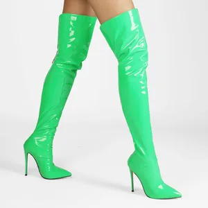 Detailed side view of neon green patent leather thigh high boots with stiletto heels