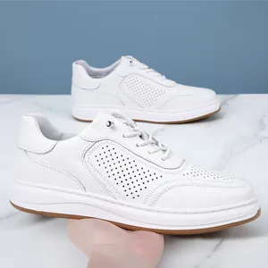 Premium white leather men's sneakers featuring breathable perforated design and no-tie laces