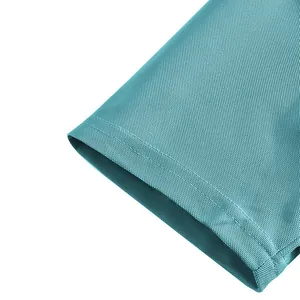 Close-up of breathable piqué fabric and double-stitched cuff on teal polo shirt