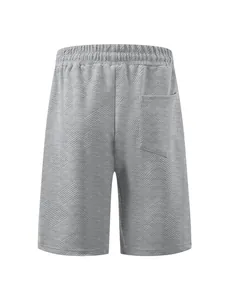 Back view of grey jacquard textured men's shorts with elastic waist and pocket