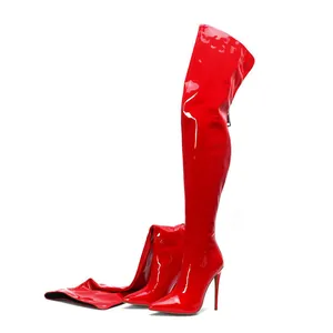High-gloss red patent leather thigh-high boots featuring stiletto heel and pointed toe.