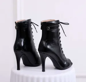 Detailed back view of professional black peep toe lace-up high heel boots for jazz dance
