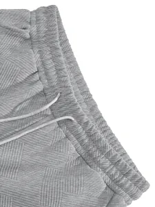 Close-up of grey men's heavy jacquard texture shorts with adjustable drawstring waist