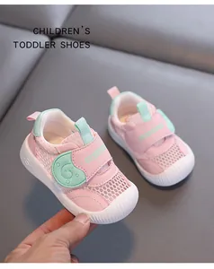 Close-up detail of breathable pink mesh toddler shoes featuring mint green Velcro straps