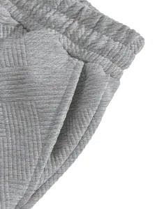Close-up view of the grey heavy jacquard texture fabric on men's high street shorts