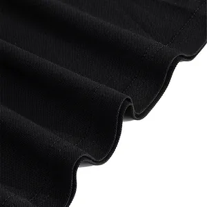Close-up detail of breathable black mesh fabric on a men's performance golf polo shirt.