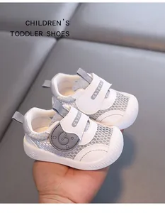 Close-up detail of white breathable mesh toddler shoes with adjustable velcro straps