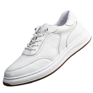 Side view of white grain leather men's casual sneaker showing fine texture and thick sole