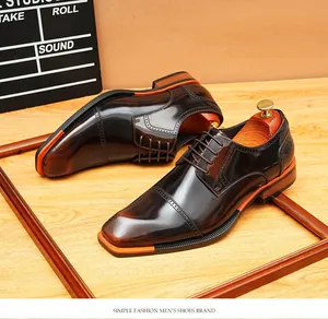 Close-up of vintage shiny brown leather Derby shoes with sharp blade toe design