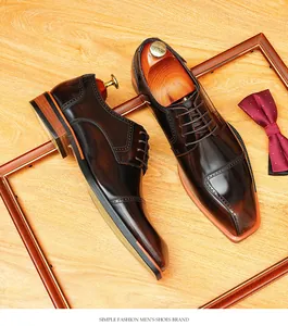 Close-up of brown glossy leather derby shoes with blade toe and brogue detailing