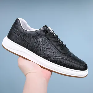 Detailed side view of black perforated leather sneaker with elastic lazy laces design
