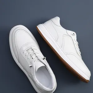 Macro detail view of premium white perforated leather sneakers with elastic laces