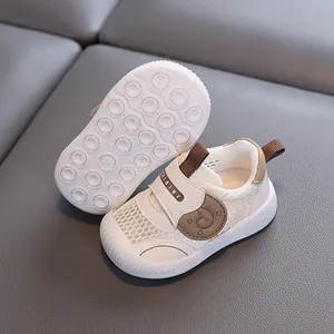 Premium breathable white mesh toddler shoes with soft non-slip soles and bear detail