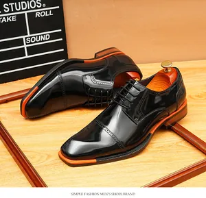 Glossy black leather Derby shoes with unique orange sole accents for formal business occasions.