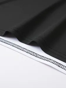 Close-up of the high-quality stitching and dual-tone fabric on a men's sports tank top.