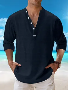 Detail of dark blue cotton linen Henley shirt with white buttons for casual beach wear