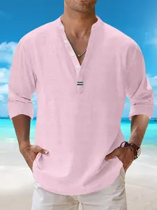 Detail of pink cotton linen beach shirt featuring stand collar and white buttons