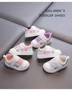 Detailed view of white toddler girls' walking shoes featuring colorful butterfly embroidery