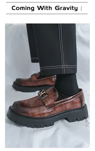 Close-up of brown crocodile pattern platform loafers for men with thick soles.