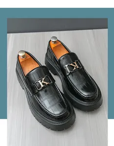 Men's black crocodile texture leather loafers with thick soles and metal K buckle.