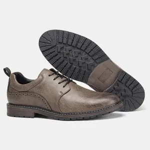 Detailed view of brown leather men's dress shoes showing outsole grip and texture