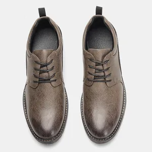 Top-down view of men's distressed brown leather dress shoes with lace-up detail