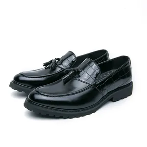 Classic black tassel loafers for men with crocodile skin pattern upper and thick sole