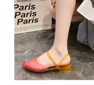 Detailed view of pink to yellow gradient crystal jelly wedge sandals