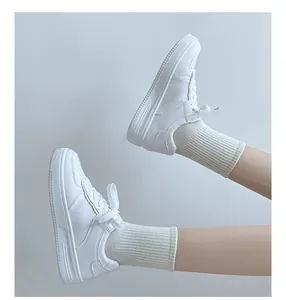 Close-up detail of stylish white platform sneakers for women with ribbed knit socks