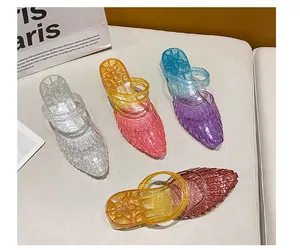 Collection of colorful glittery wedge jelly sandals for women in various gradients.