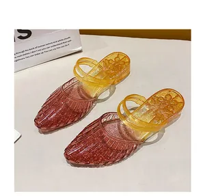 Detailed view of brown and yellow gradient glittery jelly wedge slippers for women