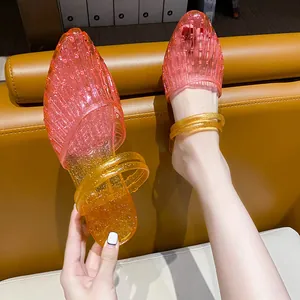 Elegant pink and yellow gradient glitter jelly wedge mules featuring a pointed toe design