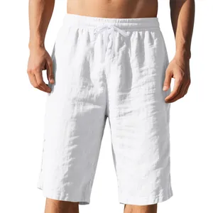 Detail view of men's white linen casual shorts with drawstring and elastic waistband