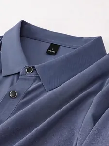 Close-up of a blue breathable ice-cool polo shirt showing its fine honeycomb texture