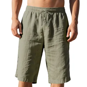 Close-up detail of men's olive green linen casual shorts with drawstring elastic waistband