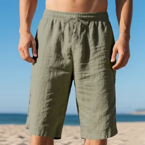 Detailed view of men's sage green linen shorts with a comfortable drawstring waist