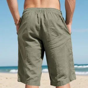 Back view of premium breathable olive green linen casual shorts for men at beach