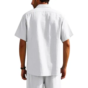 Back view of a comfortable men's white linen short sleeve shirt with matching pants
