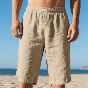 Close-up view showing the textured linen fabric and drawstring waist of men's beach shorts