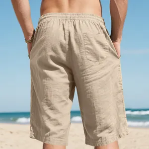 Back view of men's breathable linen shorts with elastic waist and pocket at the beach.