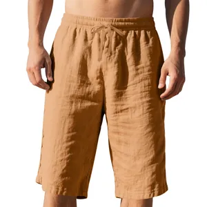 Detailed view of men's brown linen shorts with drawstring and elastic waist